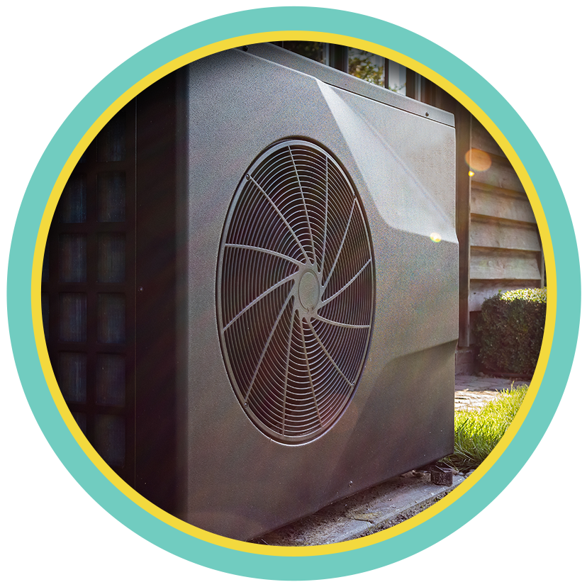 Outdoor air conditioner unit with a large fan grille in sunlight